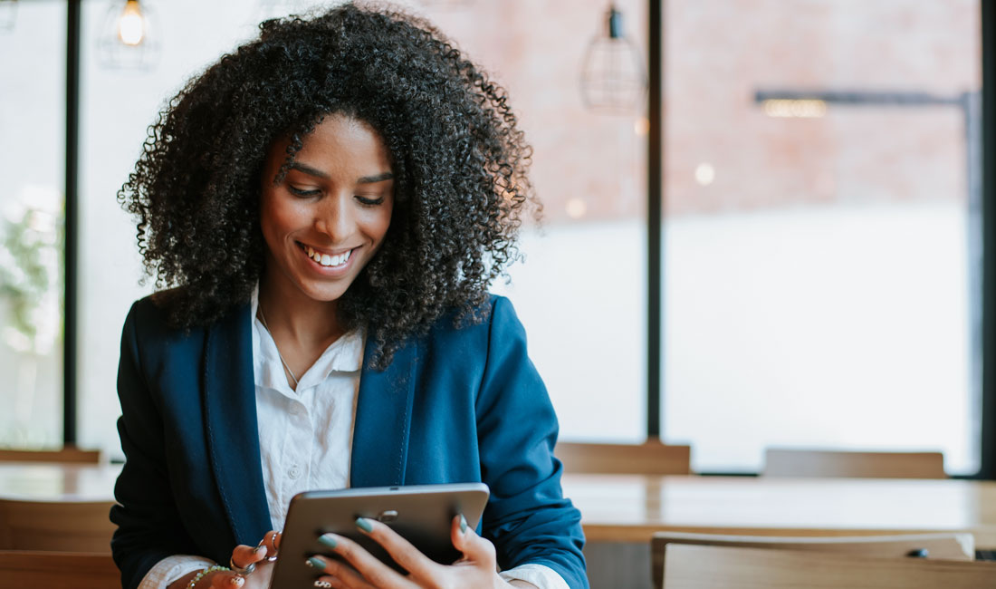 Enthusiastic employee with tablet