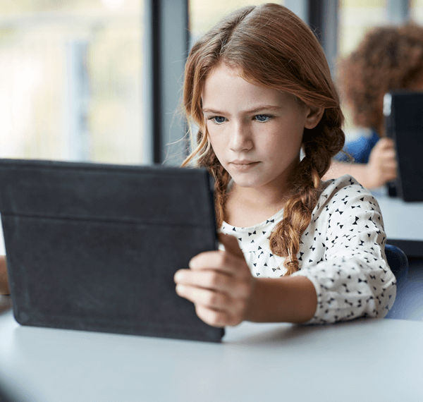 young girl working on tablet