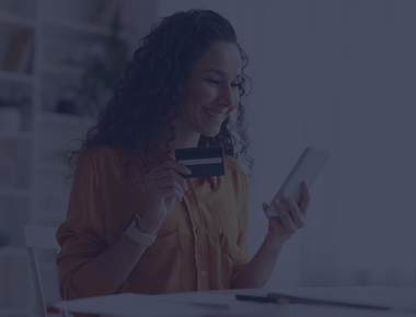 Woman smiling on phone making a payment