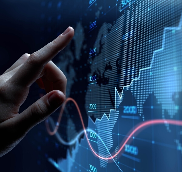 Hand pointing at data graphs
