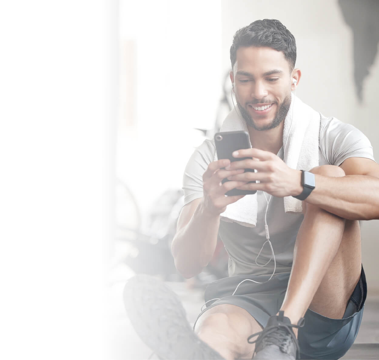 Person sitting on the floor using a phone
