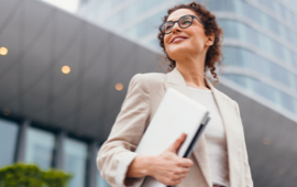 Businesswomen smiling outside office