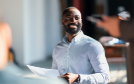 Man smiling in office
